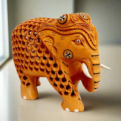 Wooden elephant idol featuring intricate lattice and carving, carrying child, suitable for gifting and home decoration