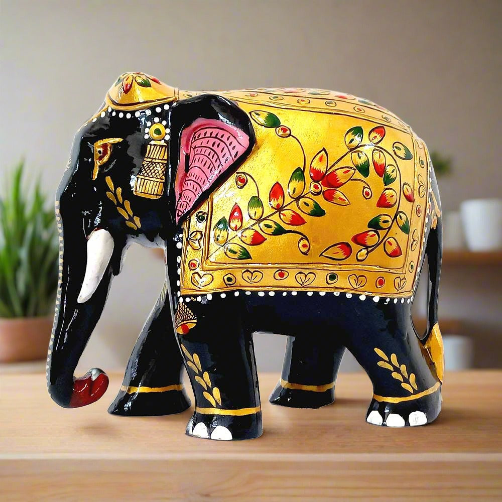  An embossed wooden elephant with a downward-facing trunk and beautiful floral painting.