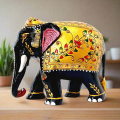  An embossed wooden elephant with a downward-facing trunk and beautiful floral painting.