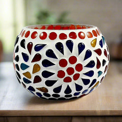 Glass candle holder featuring mosaic pattern, comes with candle, ideal for Diwali, weddings, birthdays, and anniversaries.
