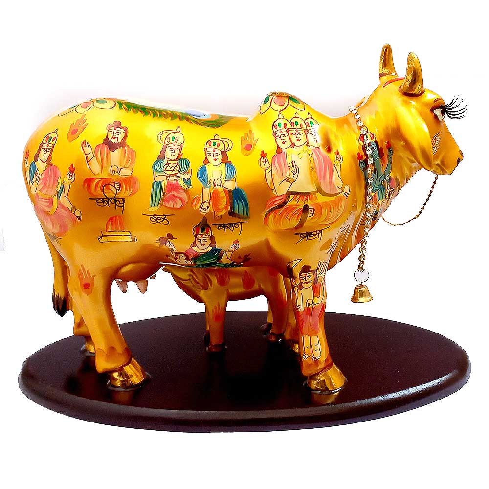 An impressive golden Kamdhenu statue, a perfect milch cow showpiece for a temple, home, or office.