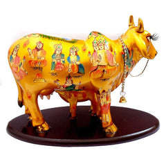 An impressive golden Kamdhenu statue, a perfect milch cow showpiece for a temple, home, or office.