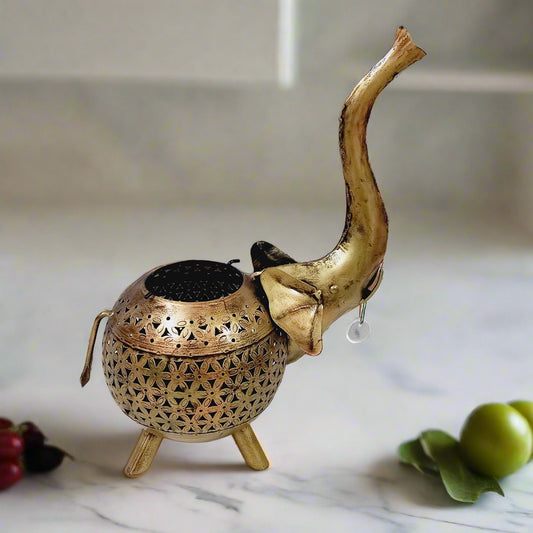 Golden mesh metal candle holder shaped like an elephant, perfect for elegant home decoration and festive occasions.