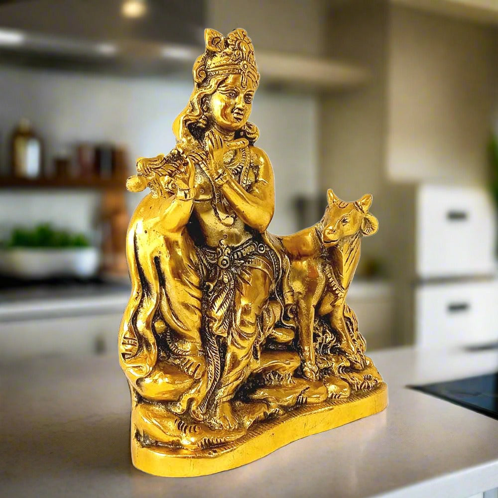 A golden oxidized Krishna statue, a perfect piece for home decor and gifting.