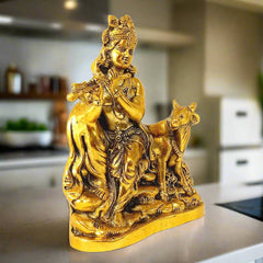 A golden oxidized Krishna statue, a perfect piece for home decor and gifting.