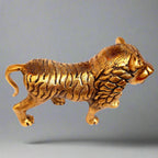 Gleaming golden polish detail on traditional Jaipur metal lion showpiece.