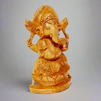 A gorgeous Ganesh figurine with a superb design, seated on a wooden lotus base.