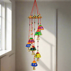 A gorgeous handmade toran with round papermache bells and a beautiful design.