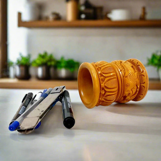 A hand-carved, thick, and round wooden desk organizer that looks valuable in an office or home.
