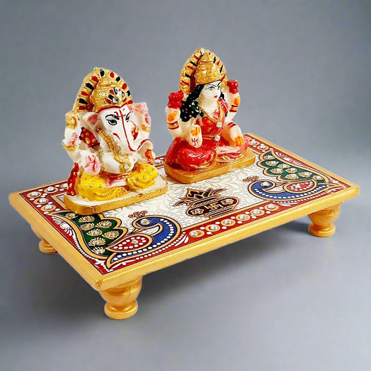 A hand-painted marble Laxmi and Ganesh statue, a perfect gift for Diwali.