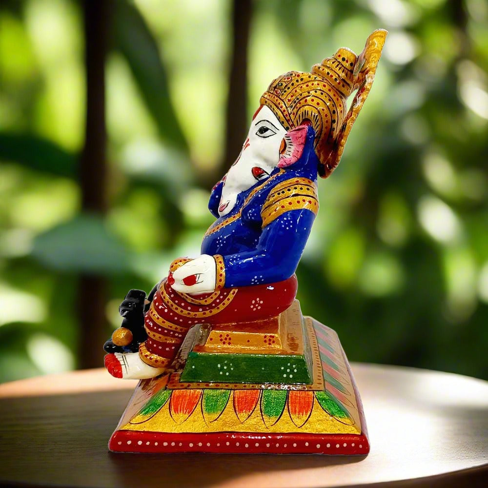 Hand-painted meenakari Ganesha idol on aasana with crown, carrying laddoos, perfect for gifting and home decoration