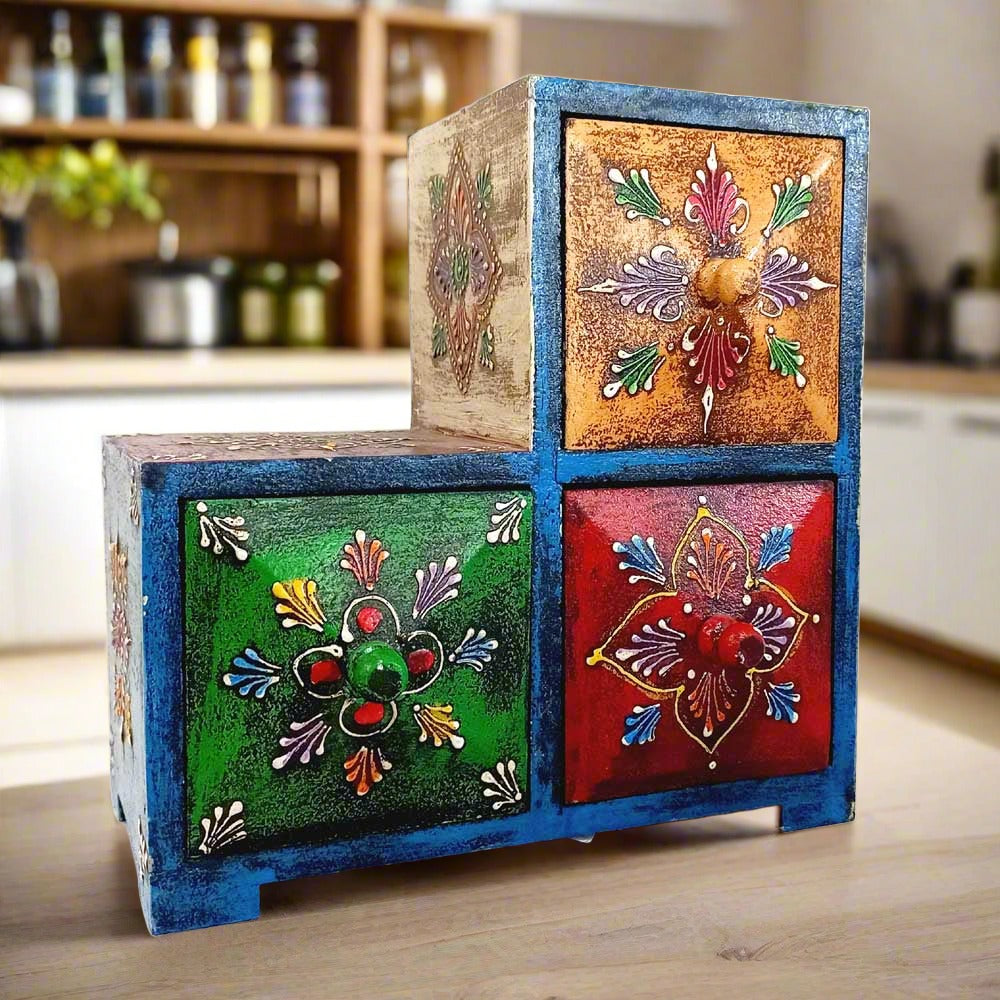 Side angle of 18cm triangular wooden paint box featuring vibrant hand-painted designs