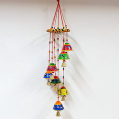 A handcrafted decorative toran with a beautiful design made with round papermache bells.