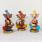 A handcrafted metal Ganpati idol showpiece set with beautiful hand painting.