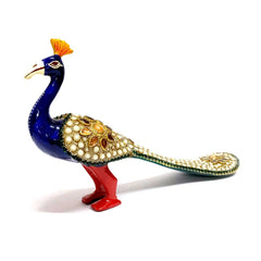 Handcrafted metal peacock home decor item with intricate stonework, pearls and enamel accents