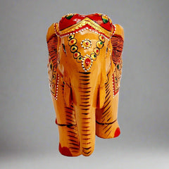 Handcrafted wooden elephant statue showcasing vibrant emboss painting and fine details