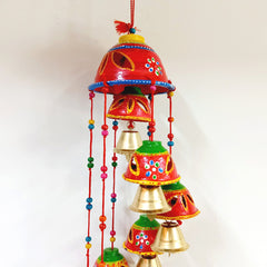 A handmade bell toran for home and office decoration, made with beads and threads.