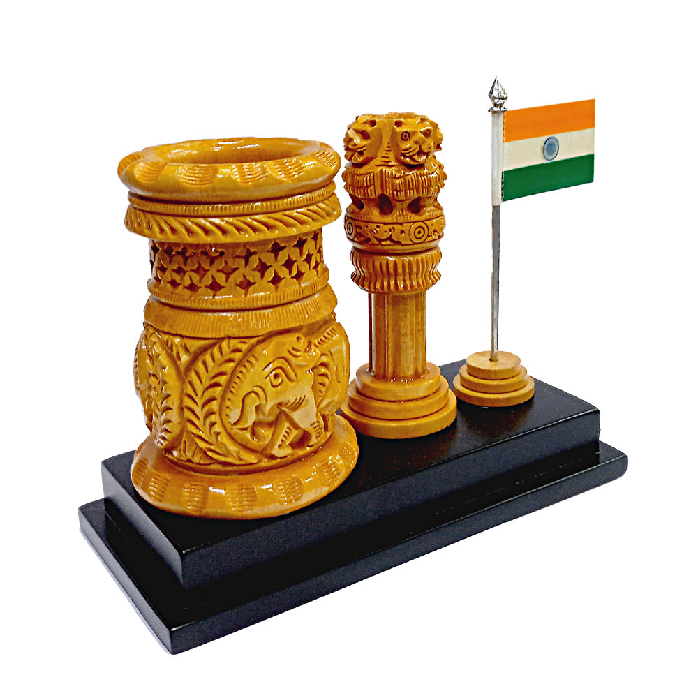 A handmade and carved pen holder with a miniature Indian National Flag and Ashoka Pillar.