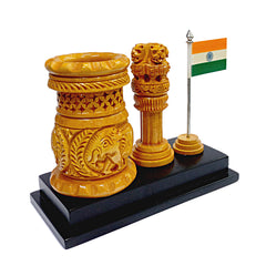 A handmade and carved pen holder with a miniature Indian National Flag and Ashoka Pillar.