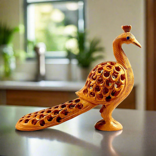 A handmade peacock made of Kadamb wood with a detailed lattice (undercut) design.