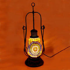 Handmade lantern-shaped lamp made of glass, metal, and wood with intricate mosaic work and crystal decorations.