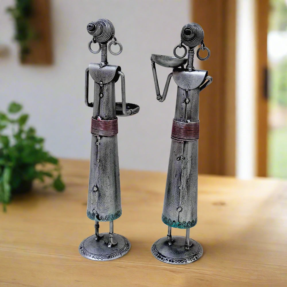 Handmade pair of metal tribal lady candle holders with exquisite emboss painting and silver oxidized color, perfect for traditional decor.