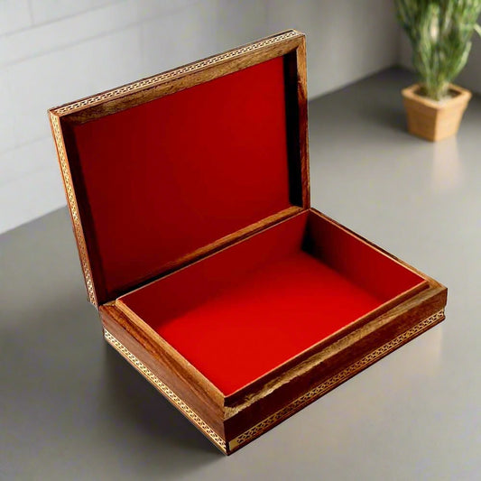 A handmade wooden jewelry box featuring a beautiful lady design and brass work on the border.