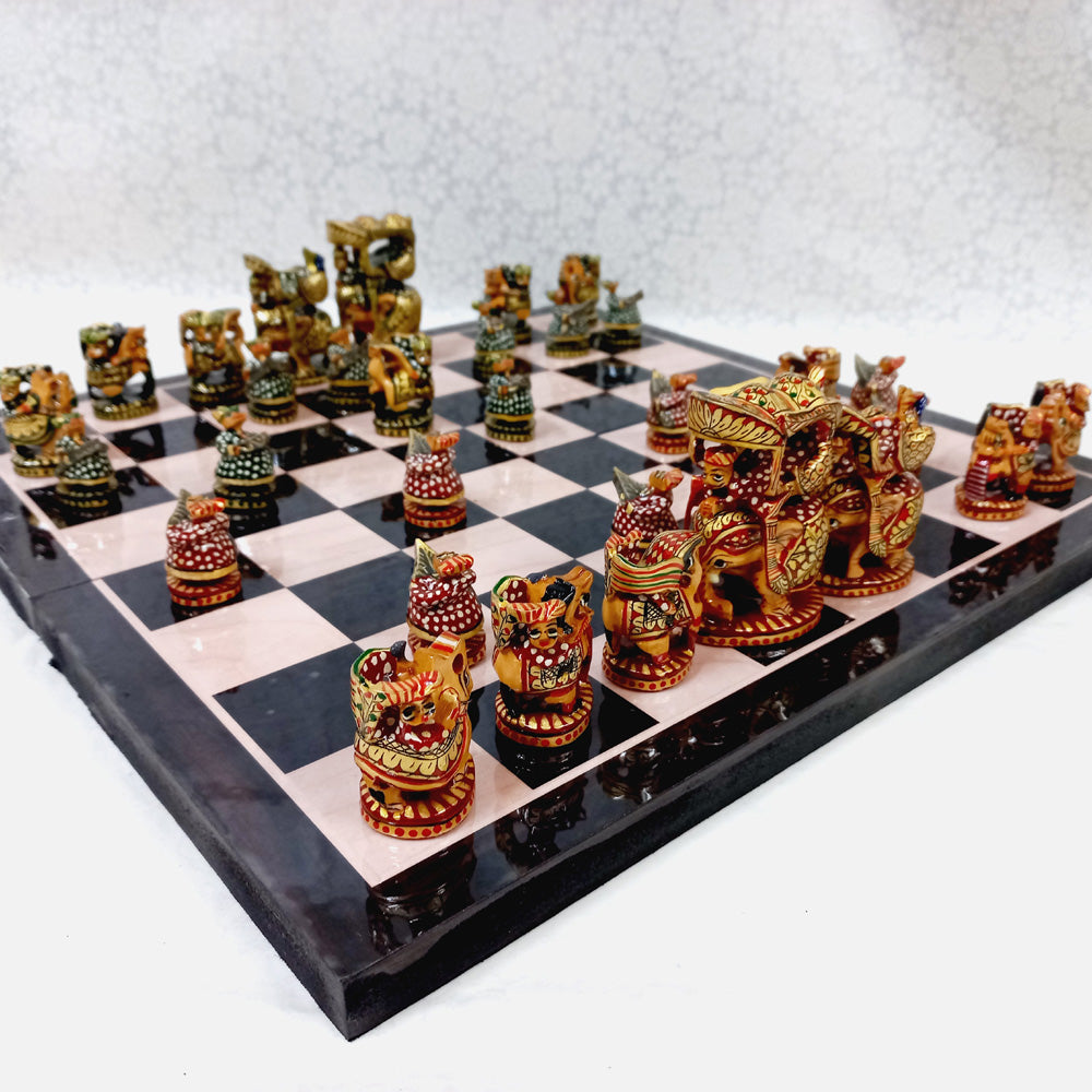 Handmade wooden chess set featuring Ambabari design elements inspired by royal Indian art, crafted with intricate details.

