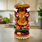 Handmade wooden Ganesha idol with round shape and umbrella design, featuring fine hand painting