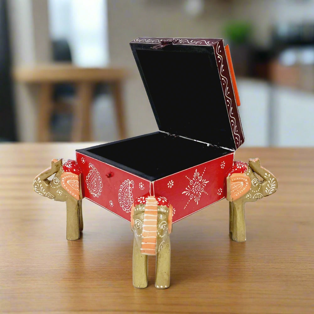 Hand-painted wooden jewelry box decorated with four elephant motifs, perfect for storing bangles, jewelry, and valuables.