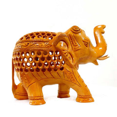 A wooden elephant showpiece with a high trunk, perfect for home decor.