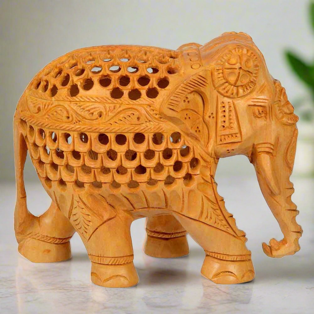 Indian wooden handicraft elephant idol with artistic undercut design.