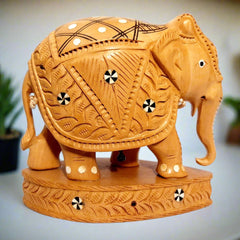 Side view of intricate inlay work on traditional Kadamb wood elephant.