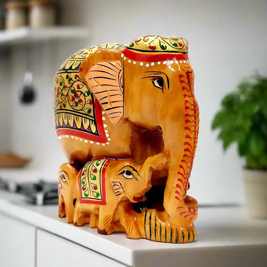 An amazing Kadamba wood figurine of a mother elephant with her babies, ideal for gifting.