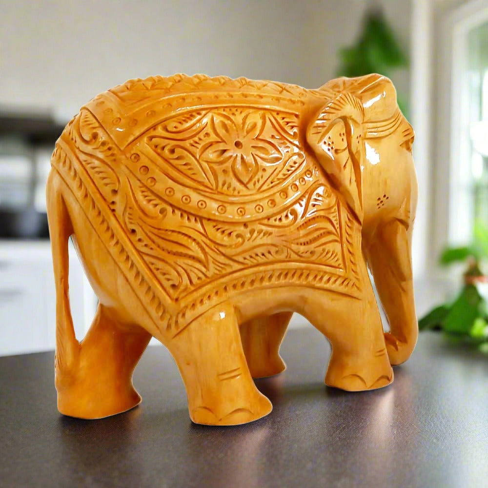 Kadamba wood elephant showpiece designed by skilled Indian craftsmen for home decor.