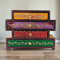 A beautiful, hand-painted wooden 4-drawer box by KKGiftStore with an embossed antique look.