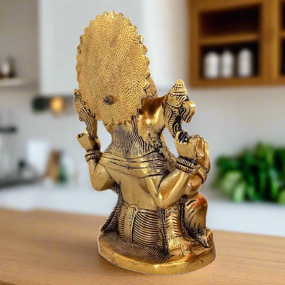 Sitting Ganesh metal murti with anti-tarnish brass finish – invites prosperity & positive energy.