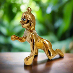 Sacred brass Baby Krishna Laddu Gopal statue, traditional Hindu deity for puja altar decoration.