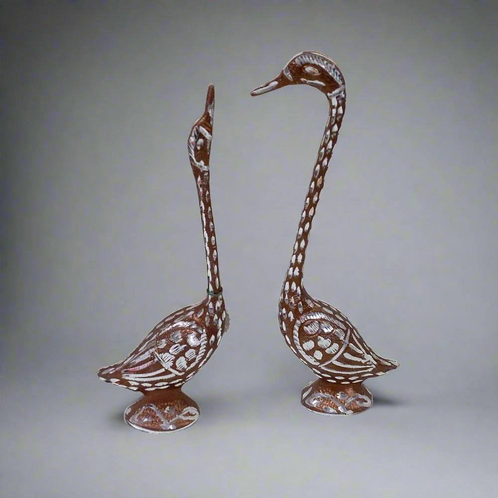 Large pair of swans metal sculpture polished with copper and silver accents, perfect for wedding and anniversary gifts.