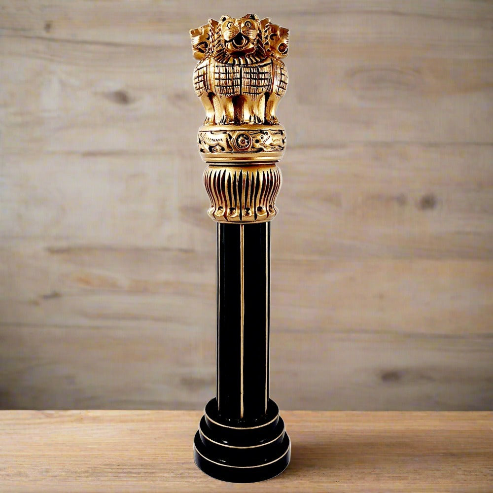 Large wooden Ashoka pillar decorated with golden brass color and lion heads, national symbol of India