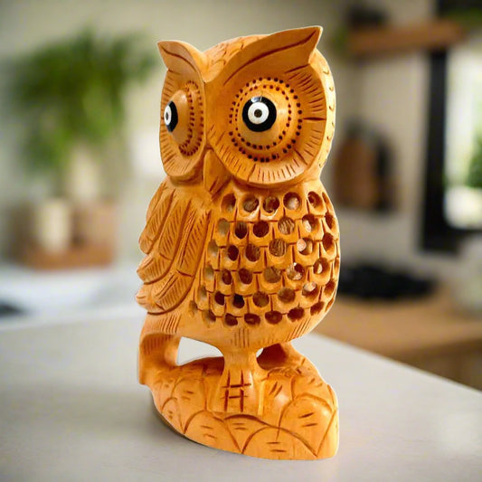 Close-up lattice belly design on premium dried wood owl showpiece featuring intricate wing carvings