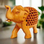 Closeup of fine lattice jali carving on traditional Jaipur wooden elephant handicraft