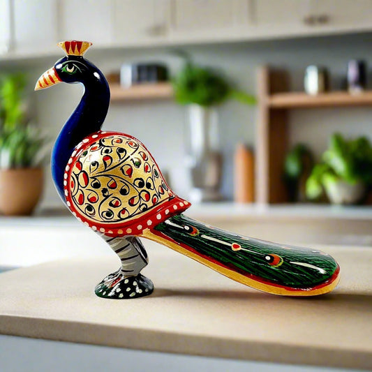 A long-tailed wooden peacock statue with very nice hand painting in vibrant colors.