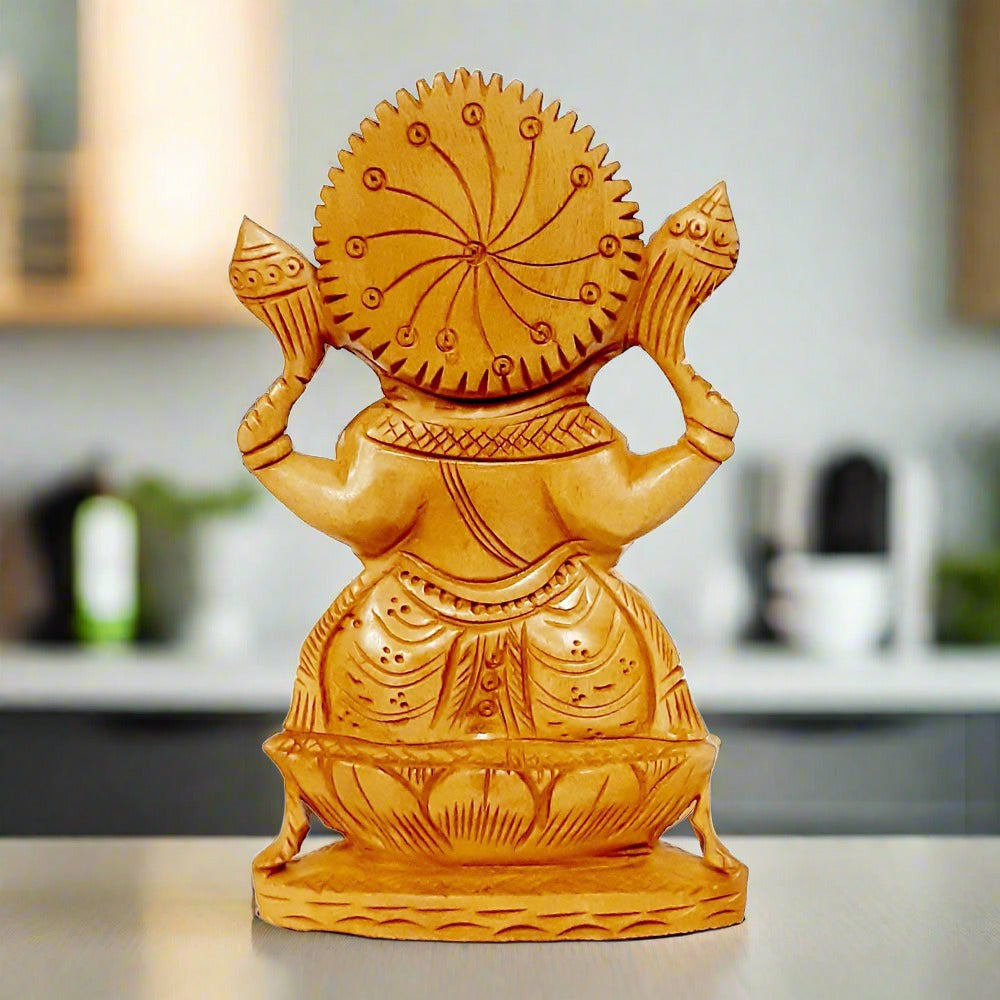 A Lord Ganesh ji statue on a wooden lotus, which brings wisdom and prosperity.