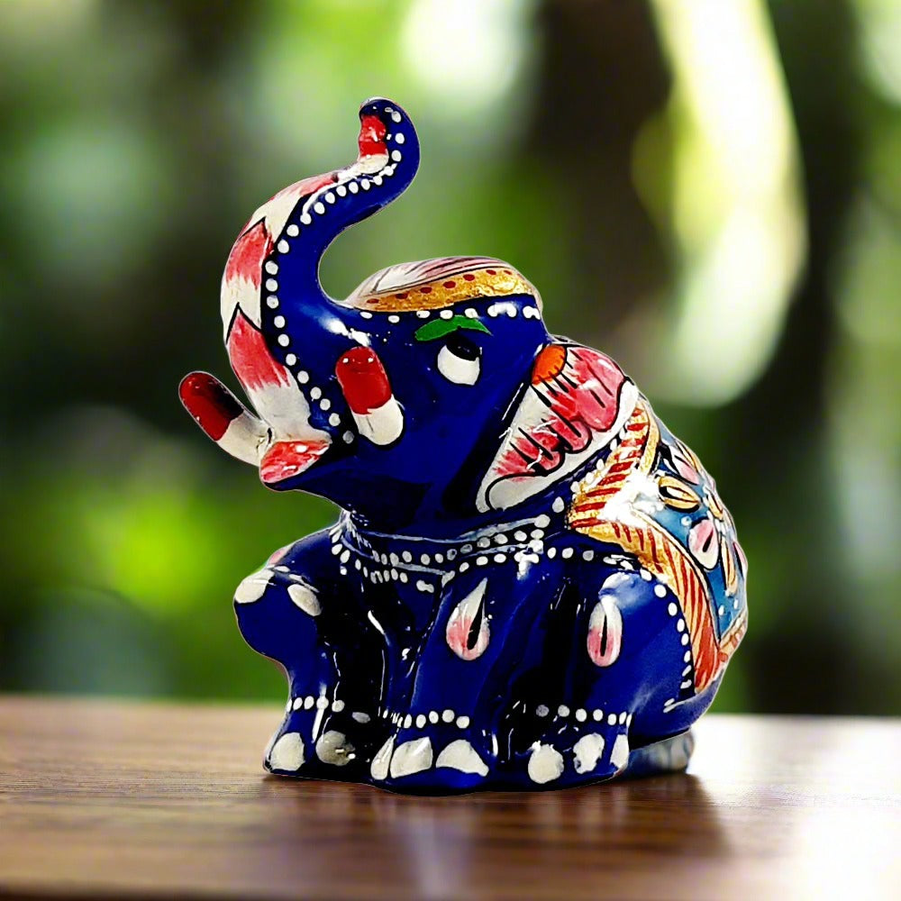 A lucky elephant showpiece, a seated metal figurine perfect for home decoration or gifting.