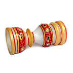 Side view of hand-painted artwork on solid marble candle holder.
