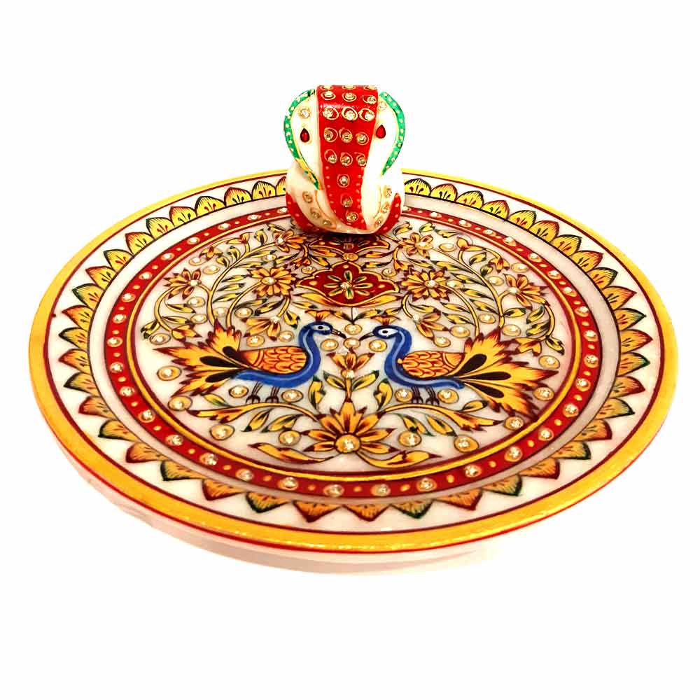 Close-up center detail showing marble Ganesha idol on hand-painted worship plate