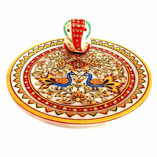Close-up center detail showing marble Ganesha idol on hand-painted worship plate