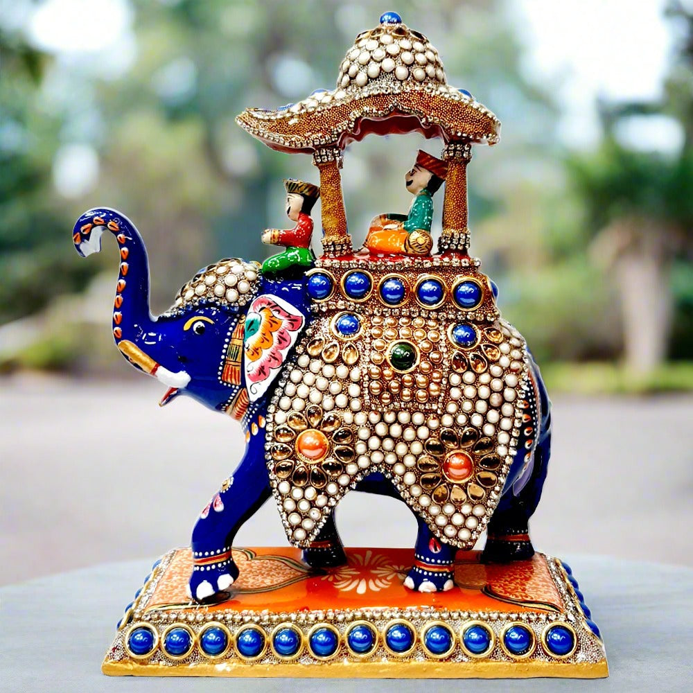 Metal Ambabari elephant statue featuring intricate meenakari artwork and decorative stones, symbolizing royal pride.