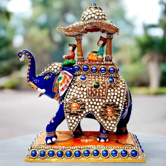 Metal Ambabari elephant statue featuring intricate meenakari artwork and decorative stones, symbolizing royal pride.